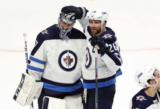 TREVOR HAGAN / WINNIPEG FREE PRESS FILESWinnipeg Jets goaltender Connor Hellebuyck, left, and team captain Blake Wheeler are headed to Las Vegas for the NHL awards on Wednesday. Hellebuyck is nominated for the Vezina and Wheeler for the Mark Messier leadership award.