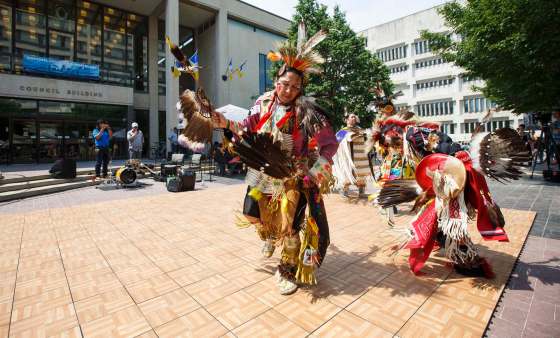 MIKE DEAL / WINNIPEG FREE PRESSDean Kiyewakan (centre) and his son Stacey Kiyewakan (right) lead the other dancers onto the floor during a celebration of National Indigenous Peoples Day at the Winnipeg City Hall courtyard Thursday afternoon. National Indigenous Peoples Day recognizes and honours the cultures of First Nations, Metis and Inuit peoples.