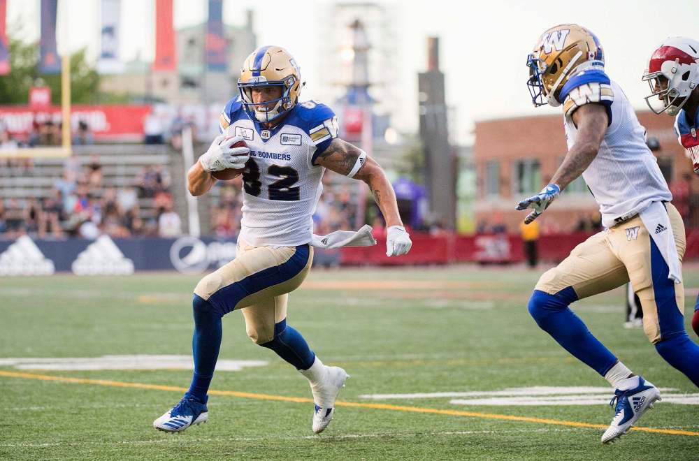 THE CANADIAN PRESS/Graham Hughes
Winnipeg Blue Bombers' Drew Wolitarsky (82) runs in for a touchdown during first half CFL football action against the Montreal Alouettes in Montreal, Friday.