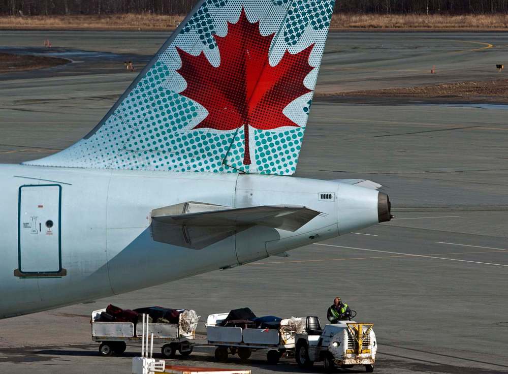 THE CANADIAN PRESS/Andrew Vaughan
Passengers of an Air Canada flight from Montreal to Winnipeg were not allowed to disembark from the their plane for over 90 minutes while it sat on the tarmac in Winnipeg passengers say.