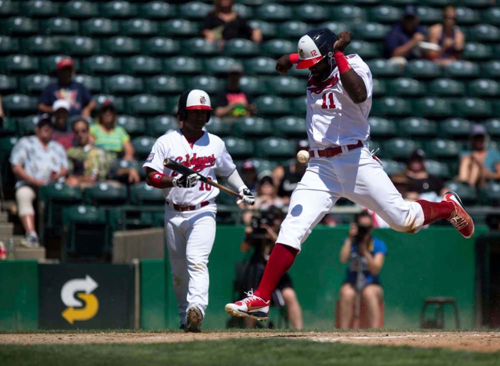 ANDREW RYAN / WINNIPEG FREE PRESS
Reggie Abercrombie scores the first run for the Winnipeg Goldeyes at Shaw Park Tuesday.