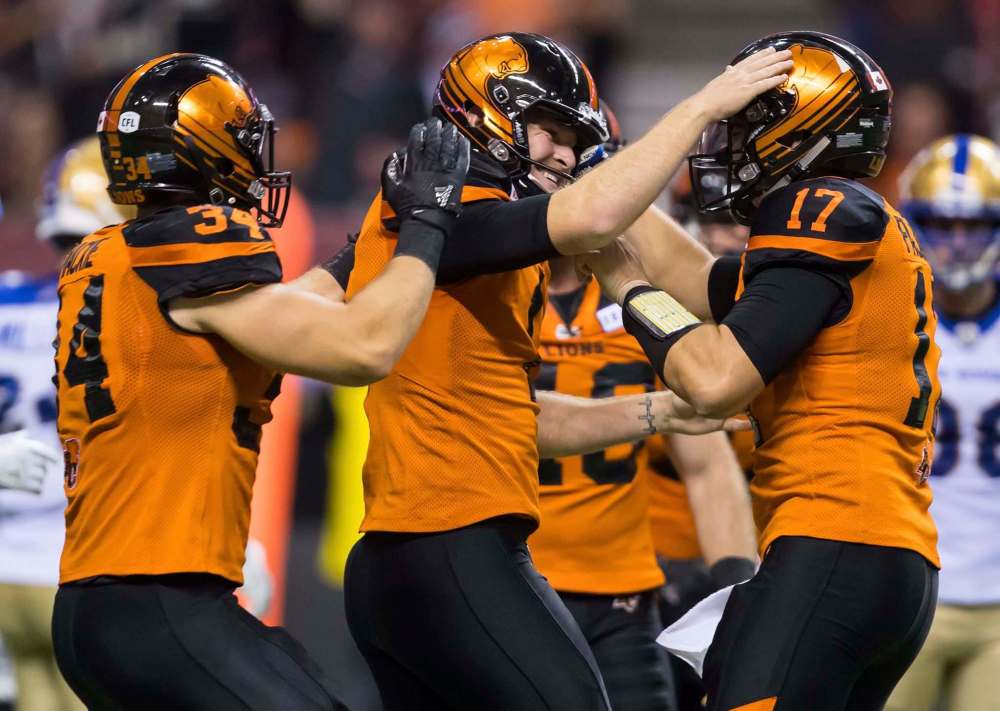 DARRYL DYCK / THE CANADIAN PRESS
Lions kicker Ty Long (centre) celebrates kicking the game-winning field goal with Cody Fajardo (right) and David Mackie in B.C.’s come-from-behind 20-17 win over the visiting Blue Bombers on Saturday in Vancouver.
