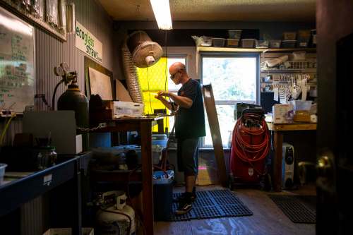 Craig Graffius, polishing a glass straw at the EcoGlass Straws facility in Hood River, Ore., on July 5, spent a long time trying to convince people his product wasn&rsquo;t a gimmick. (Terray Sylvester / Bloomberg)