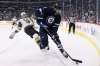 John Woods / The Canadian Press Files
Winnipeg Jets' Adam Lowry wins a puck battle against Vegas Golden Knights' Colin Miller. The Jets big-bodied fourth-line centre has signed a new contract to keep him Winnipeg for the next three seasons.