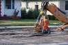 (Mike Deal / Winnipeg Free Press)
A Winnipeg Water Services crew gets ready to drill holes in the northbound lanes of McPhillips Street between College Avenue and Redwood Avenue Monday morning after a severe water main break buckled the pavement.