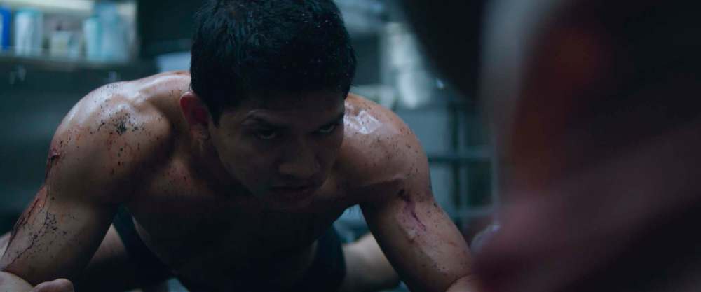 Li Noor (Iko Uwais) seeks protection in trade for a critical digital storage device.