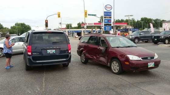 SUPPLIEDLay minister Thomas Novak’s Ford Focus (right) was totalled when it was T-boned in the intersection of Inkster Boulevard and McPhillips Street during a funeral procession on Aug. 13.