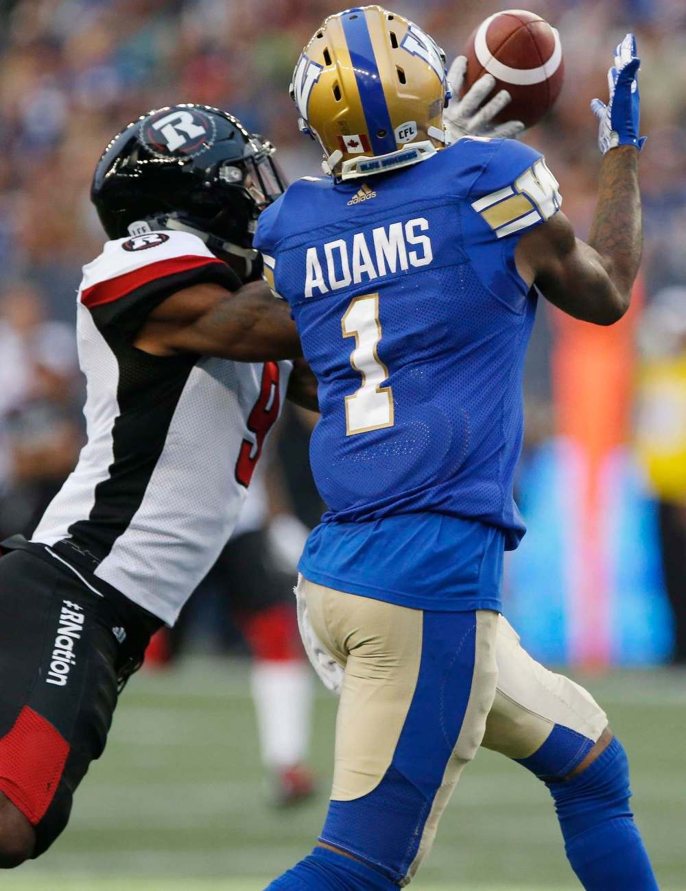 JOHN WOODS / THE CANADIAN PRESS FILES
Ottawa Redblacks' Jonathan Rose (9) can't stop Winnipeg Blue Bombers' Darvin Adams (1) from making the touchdown catch during the first half of CFL action in Winnipeg Friday, August 17, 2018.