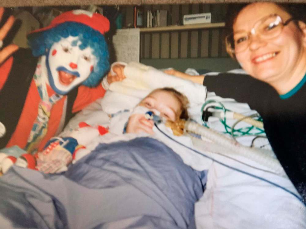 SUPPLIED
Hubert the Clown visits Irene and Brenda-Lea Tully in the Children’s Hospital in 1991.
