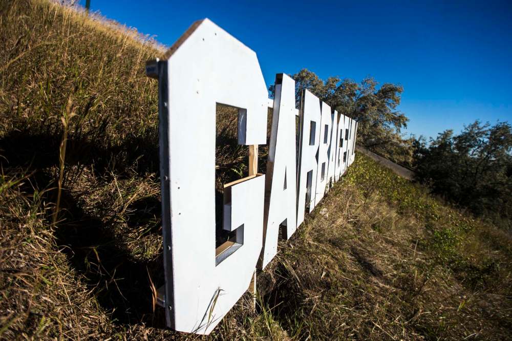The sign was made out of wood with a Styrofoam core, and moored in post holes dug into the east-facing side of Westview Park above the roadway leading to the top of the hill. (Mikaela MacKenzie / Winnipeg Free Press)