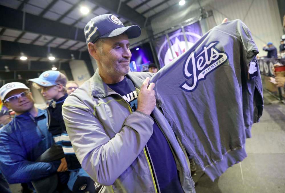 Shawn McCartney picks out some merchandise.