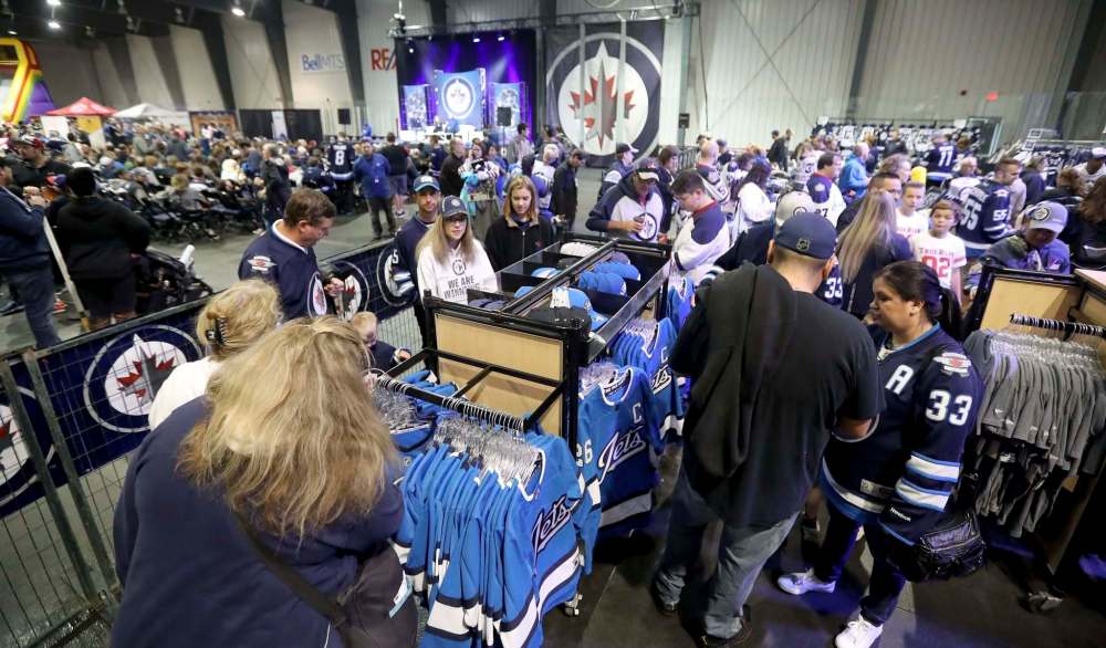Jets' fans shop for merchandise this morning at Fan Fest.
