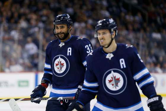 JOHN WOODS / WINNIPEG FREE PRESS filesJets players Dustin Byfuglien (left) and Mark Scheifele are being counted on to reprise their game-changing roles from last season to help the squad succeed again this season.