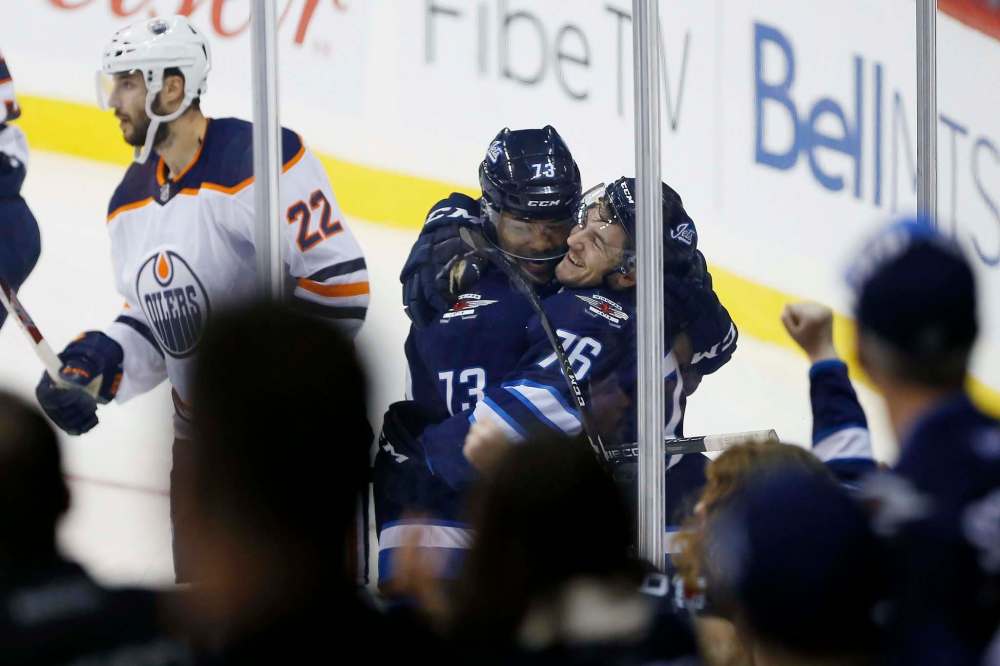 JOHN WOODS / WINNIPEG FREE PRESS
Winnipeg Jets' Skyler McKenzie (76) and C.J. Suess (73) celebrate McKenzie's second goal of the game during third period pre-season NHL action against the Edmonton Oilers in Winnipeg on Sunday, September 23, 2018.