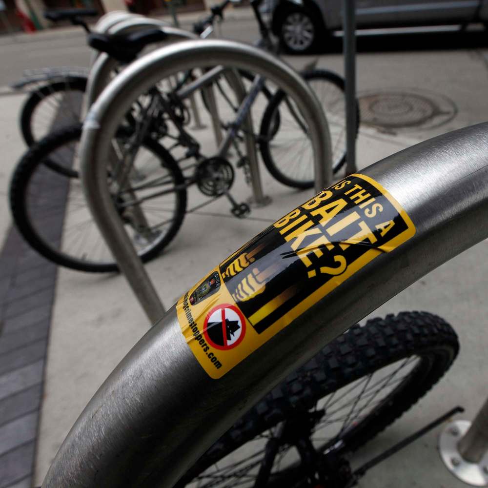 PHIL HOSSACK / WINNIPEG FREE PRESS
Bait Bike stickers on bicycle racks downtown at the Millenium Library.