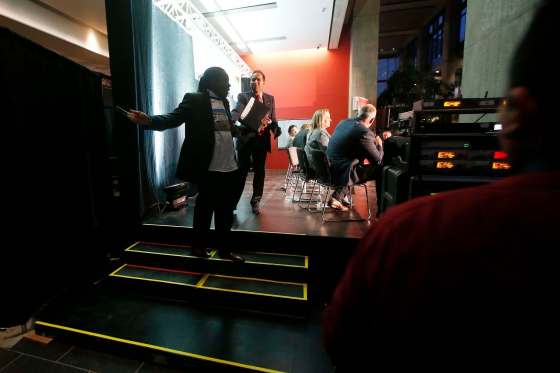 JOHN WOODS / WINNIPEG FREE PRESSMayoral candidate Umar Hayat attempts to convince Don Woodstock to come back to the stage after he dropped his mic and left the stage during a mayoral debate Tuesday.