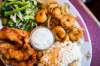 Chicken fingers, mixed greens, pan-fried whole shrimp and fried rice.