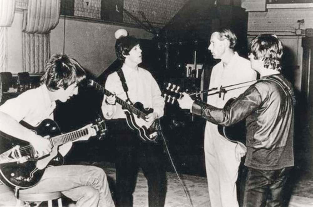 THE ASSOCIATED PRESS
George Harrison (from left), Paul McCartney, producer George Martin and Ringo Starr discuss a Beatles song in the studio in 1966. Sound engineer Geoff Emerick (below, right) helped create the Beatles sound during many of these sessions.