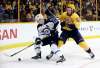 AP Photo/Mark Humphrey
Winnipeg Jets center Mark Scheifele and Nashville Predators center Ryan Johansen battle for the puck. The two have voiced a mutual respect for each other as players.