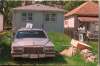 Police investigate the slayings of Russell Krowetz, Stefan Zurstegge and James Gross at 319 Semple Ave. (Winnipeg Free Press files)