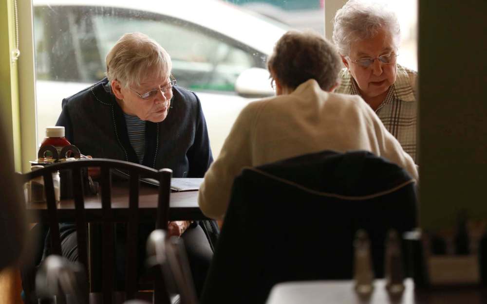 Patrons look over the menu.