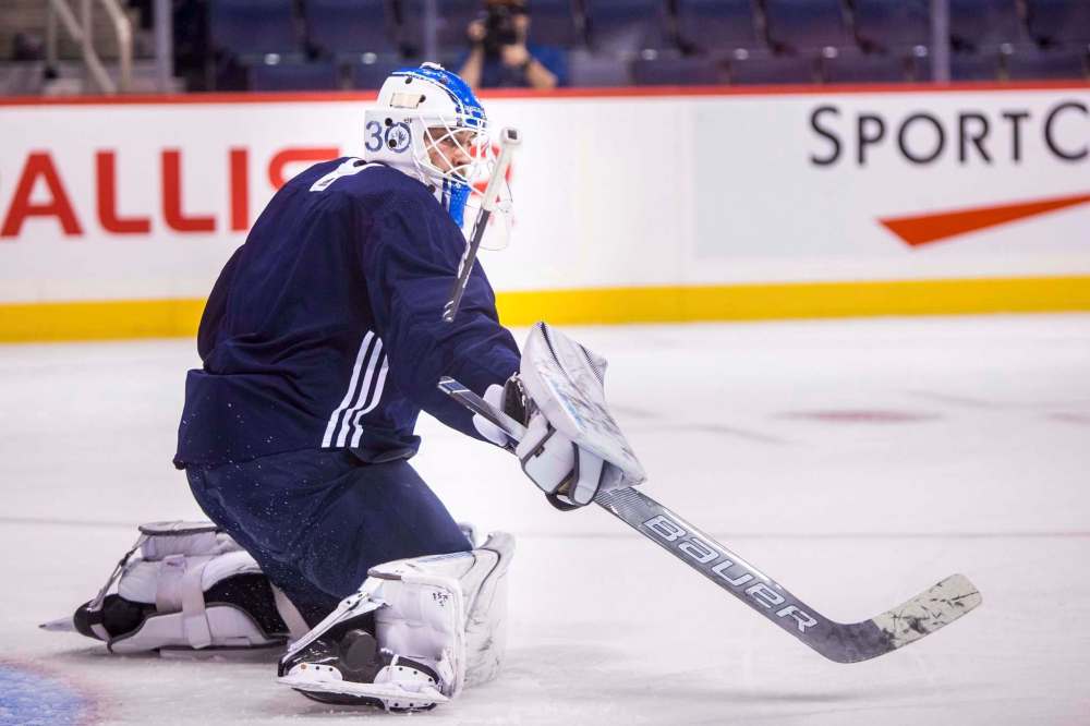 MIKAELA MACKENZIE / WINNIPEG FREE PRESS Backup goalie Laurent Brossoit at the Jets practice at Bell MTS Place in Winnipeg on Saturday, Oct. 13, 2018. Winnipeg Free Press 2018.