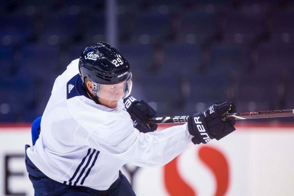 MIKAELA MACKENZIE / WINNIPEG FREE PRESS
Jets forward Patrik Laine fires a shot during practice Saturday at Bell MTS Place. With one goal in four games, the flashy Finn would like to score more along with his linemates.