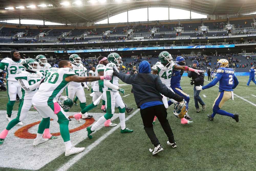 JOHN WOODS / THE CANADIAN PRESS
Tempers get a little hot as Winnipeg Blue Bombers' Kenbrell Thompkins (2) goes up against part of the Saskatchewan Roughriders team after CFL action and defeating the Roughriders 31-0 in Winnipeg Saturday, October 13, 2018.
