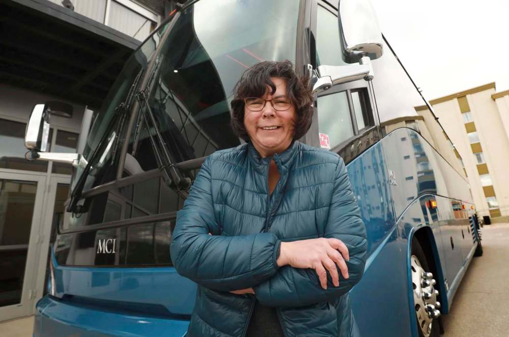 RUTH BONNEVILLE / WINNIPEG FREE PRESS
Suzanne Barbeau-Bracegirdle, CEO of Kelsey Bus Lines, next to one of their new busses in Winnipeg.