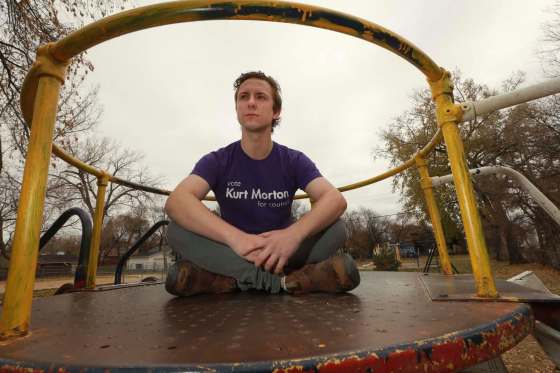 St. James council candidate Kurt Morton, sitting at a playground at Marjorie Park on Marjorie Street, says recreation infrastructure hasn't been a city priority for years.  RUTH BONNEVILLE / WINNIPEG FREE PRESS