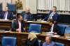 MIKE DEAL / WINNIPEG FREE PRESS
MLAs Shannon Martin and Ron Schuler chat over MLA Cliff Graydon's empty seat just before the start of question period in the Manitoba Legislature Monday morning.