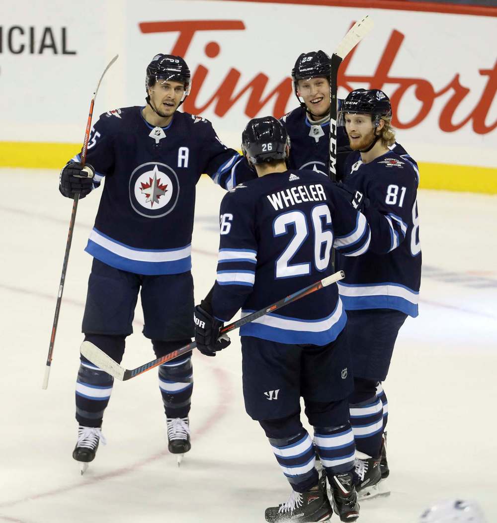 Patrik Laine's promotion to the top line with Mark Scheifele (55) and Blake Wheeler (26), will mean Kyle Connor (81) moves onto the second unit. (Trevor Hagan / Free Press files)