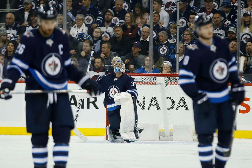 In eight starts, Connor Hellebuyck has let in four goals twice and five goals twice. (John Woods / Winnipeg Free Press files)