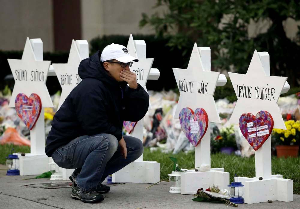 Matt Rourke / The Associated Press
A person pauses in front of memorials with the names of those killed in a shooting at the Tree of Life Synagogue in Pittsburgh.