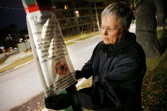 JOHN WOODS / WINNIPEG FREE PRESSLetty Lawrence, creator of the Loved and Were Loved project, with the piece in honour of David Leland Bawlf, who was an 18 year old student who lived at 11 Kennedy Street and died in the First World War on April 21, 1918. The project honours soldiers who lived in the communities and died in the world wars.