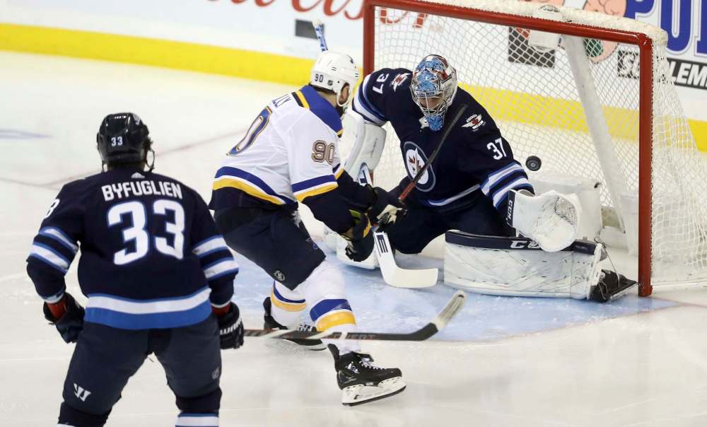 Teams seem to know to shoot high on Connor Hellebuyck. (Trevor Hagan / The Canadian Press files)