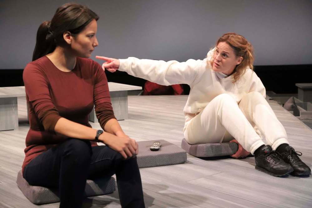 Darla Contois (left) and Alicia Johnston attempt to make a connection in Pamela Mala Sinha’s quasi-autobiographical tale, Happy Place. (Leif Norman / PTE)