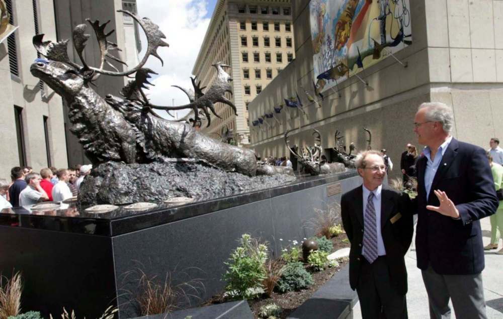 WAYNE GLOWACKI / WINNIPEG FREE PRESS files
Peter Sawatzky (left) and Hartley Richardson stand with Sawatzky’s sculpture Seal River Crossing at Richardson Centre Plaza.