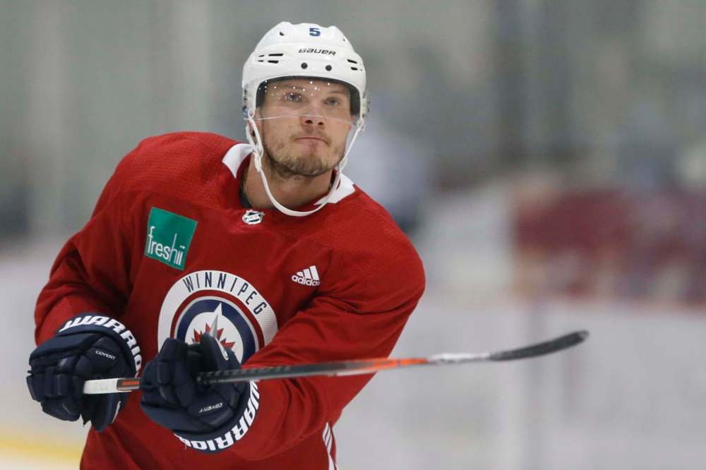 Jets defenceman Dmitry Kulikov (upper body) skated for the first time in a regular red jersey and is close to returning to the lineup. (John Woods / Winnipeg Free Press files)