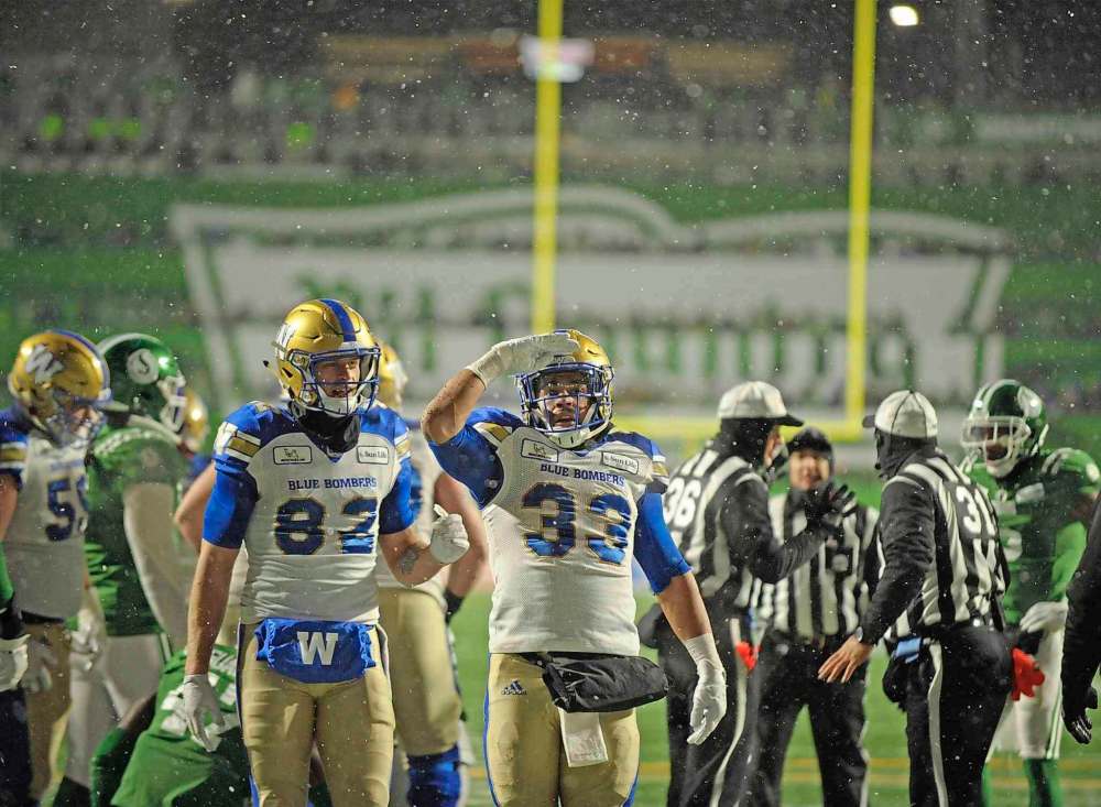 THE CANADIAN PRESS/Mark Taylor
Winnipeg Blue Bombers running back Andrew Harris, centre, celebrates a touchdown run against the Saskatchewan Roughriders in Regina on Sunday. Everyone, including the Roughriders, knew the Bombers were going to run the ball but the Bombers' dominant offensive line ensured there wasn't much the 'Riders defence could do about it.