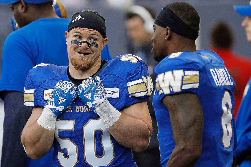 THE CANADIAN PRESS/John Woods
Winnipeg Blue Bombers' Adam Bighill, left, is an inspirational leader for the team's defence.