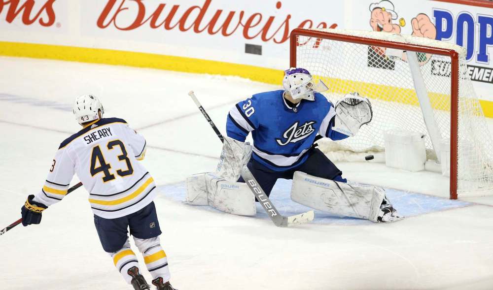 THE CANADIAN PRESS/Jason Halstead
Buffalo Sabres forward Conor Sheary scores the game-winning shootout goal on Winnipeg Jets goaltender Laurent Brossoit Friday at Bell MTS Place in Winnipeg.