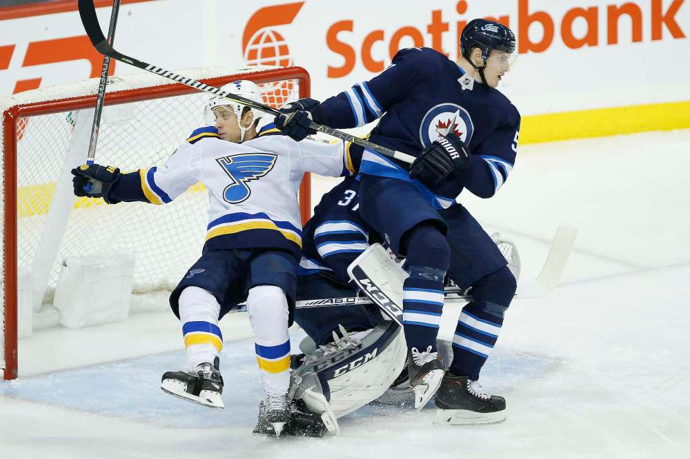 JOHN WOODS / WINNIPEG FREE PRESS
Winnipeg Jets’ Tyler Myers takes St. Louis Blues’ Jaden Schwartz out of the play in front of the Jets net.