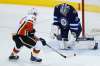 John Woods / THE CANADIAN PRESS FILES
Winnipeg Jets goaltender Connor Hellebuyck saves a breakaway attempt by Calgary Flames' Johnny Gaudreau. The next few games will be a good test for the Jets beginning with a match against the high-flying Flames Wednesday in Calgary.