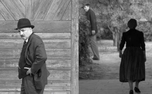 Town clerk István Szentes (Péter Rudolf) worries about his town&rsquo;s unwelcome visitors, while Mr. and Mrs. Kustár linger in the background, in a scene from the Hungarian film 1945. (Lenke Szilagyi / Menemsha Films)