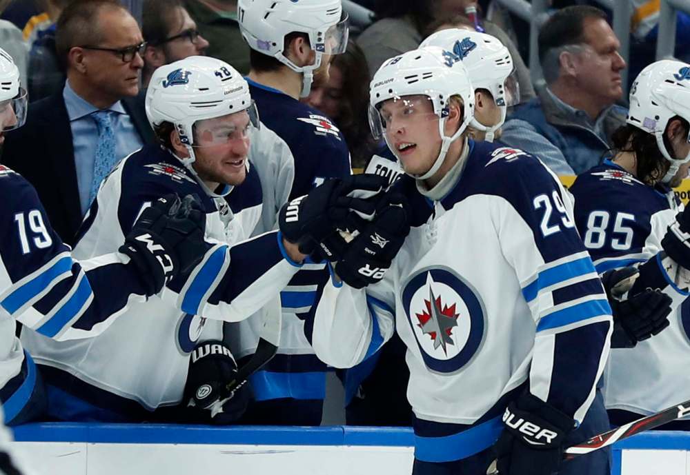 JEFF ROBERTSON / THE ASSOCIATED PRESS
Winnipeg Jets' Patrik Laine (29), of Finland, is congratulated by Brendan Lemieux after scoring during the second period of an NHL hockey game against the St. Louis Blues, Saturday, Nov. 24, 2018, in St. Louis.