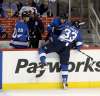THE CANADIAN PRESS / Trevor Hagan
Dustin Byfuglien is helped off the ice after he hit Pittsburgh Penguins' Jamie Oleksiak during first period in Winnipeg, Tuesday. Byfuglien would be placed into concussion protocol but would return to the game. Two days later, he was placed on the Jets injured reserve list with a concussion as a result of the hit.