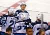 Winnipeg Jets center Jack Roslovic (28) celebrates with teammates after scoring a goal against the New York Rangers during the third period of an NHL hockey game, Sunday, Dec. 2, 2018, in New York. The Winnipeg Jets won 4-0. (AP Photo/Noah K. Murray)