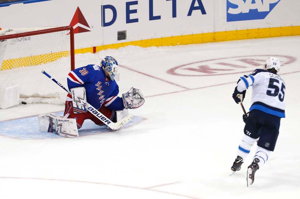 Mark Scheifele got his second game winner in two nights, beating New York Rangers goaltender Henrik Lundqvist during a shootout Sunday. (Noah K. Murray / The Associated Press files)