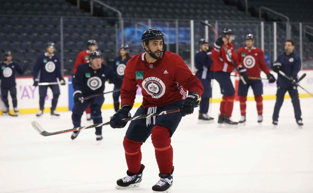 Dusting Byfuglien, who missed four games with a concussion, rejoins Ben Chiarot on the blue line. (Ruth Bonneville / Free Press files)